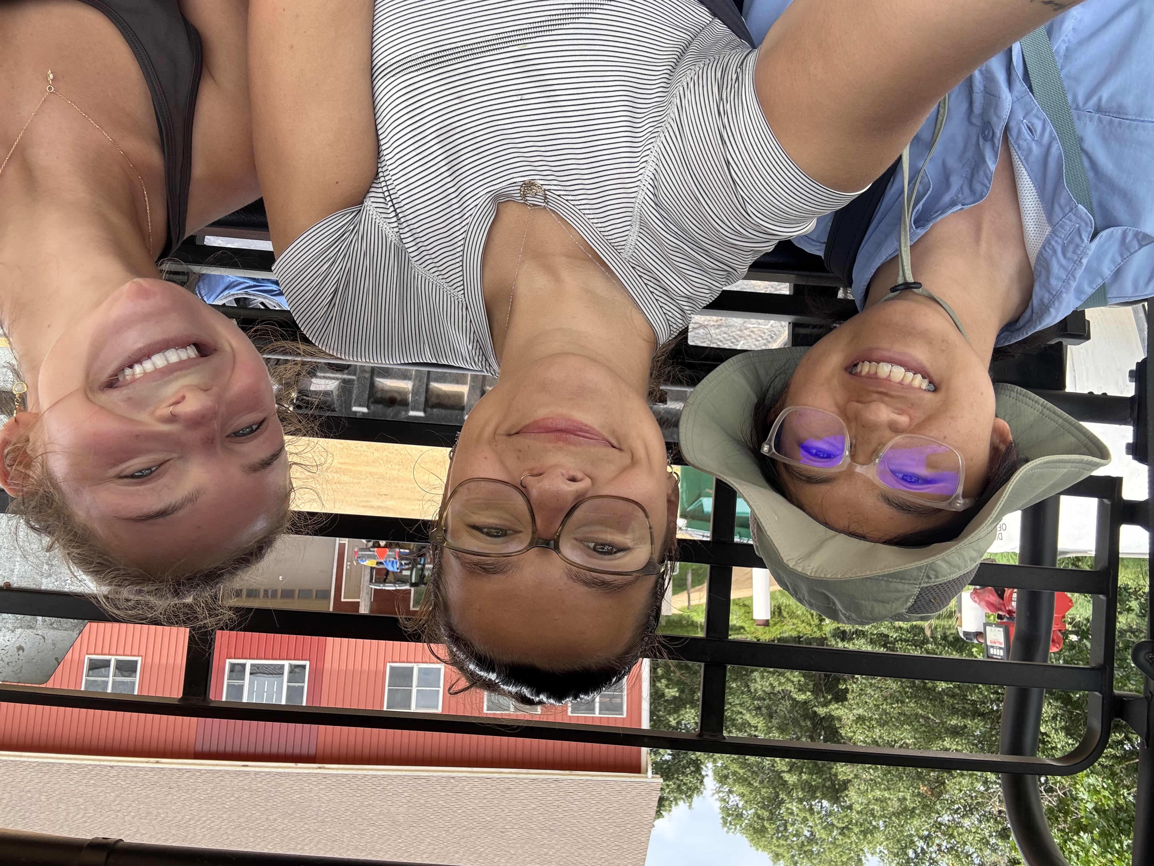 AJ, Lily, and Elsa in a UTV at Nachusa Grassland